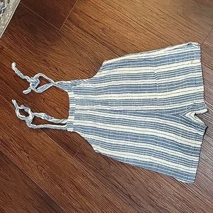 RIP CURL S ROMPER IN BLUE AND WHITE. TIES AT THE SHOULDER AND 2 POCKETS.